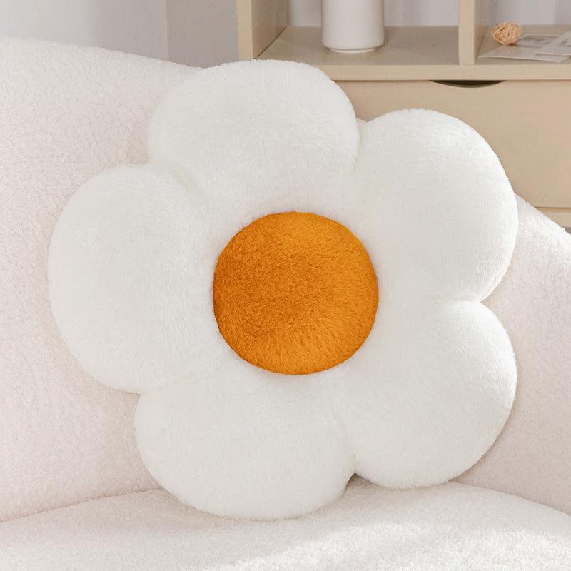 A soft white petal-shaped pillow.